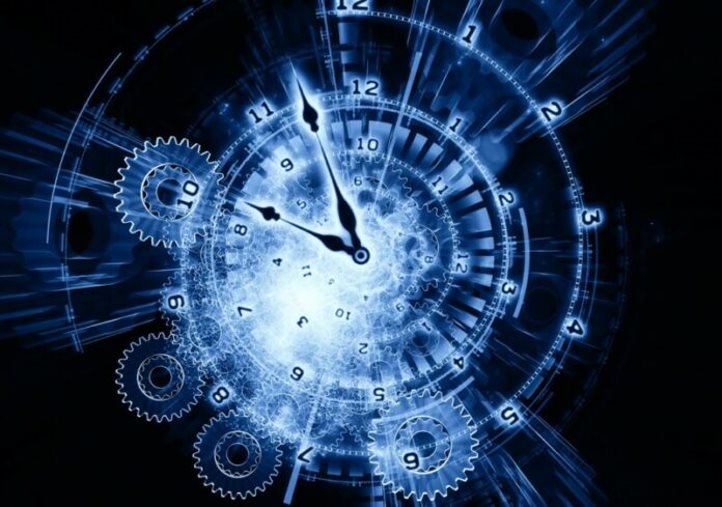 Un reloj en el medio  Descripción generada automáticamente con confianza baja